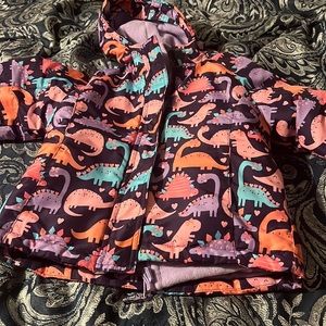 Children place dinosaur’s print jacket. Size 4t, worn before